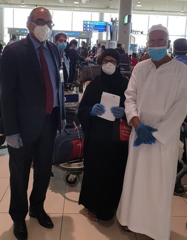 Vipul, the consul general of India in Dubai, with an elderly couple travelling on Dubai-Kozhikode flight at Dubai Airport on Thursday. (Twitter) 