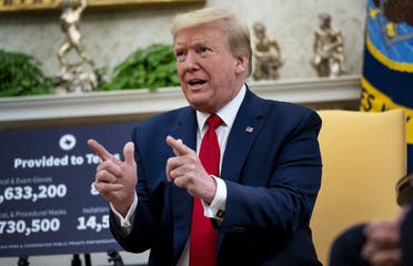 US President Donald Trump speaks to reporters while hosting Texas Governor Greg Abbott about what his state has done to restart business during the novel coronavirus pandemic in the Oval Office at the White House. (AFP)
