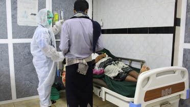 A medic wearing a protective suit attends to a patient at the emergency ward of a hospital for coronavirus in Aden, Yemen April 30, 2020. (Reuters)