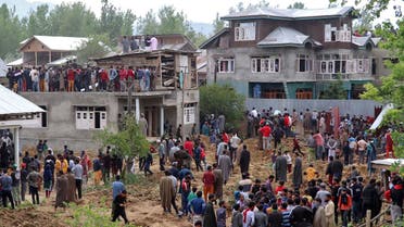   People gather after two militants were killed in a gun battle with Indian soldiers at Beighpora village in south Kashmir's Pulwama district, on May 6, 2020. (Reuters) 