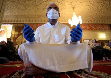 A man prays as he wears a mask and gloves as a preventive measure against the spread of the coronavirus disease (COVID-19) outbreak, as Lebanon?s mosques reopened their doors for Friday prayers, at a mosque in Sidon, Lebanon May 8, 2020. (Reuters)