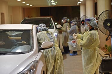 Health workers perform a nose swab test during a drive through coronavirus test campaign held in Diriyah hospital in the Saudi capital Riyadh on May 7, 2020 amid the COVID-19 pandemic. (File photo)