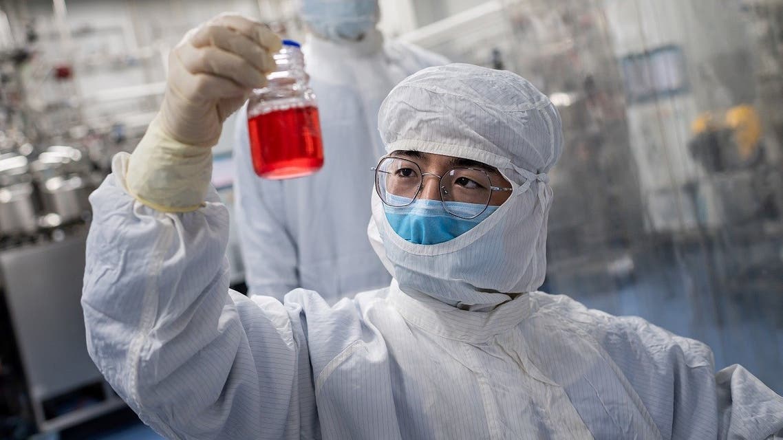 An engineer looks at monkey kidney cells as he make a test on an experimental vaccine for the COVID-19 coronavirus. (Illustrative photo: AFP)