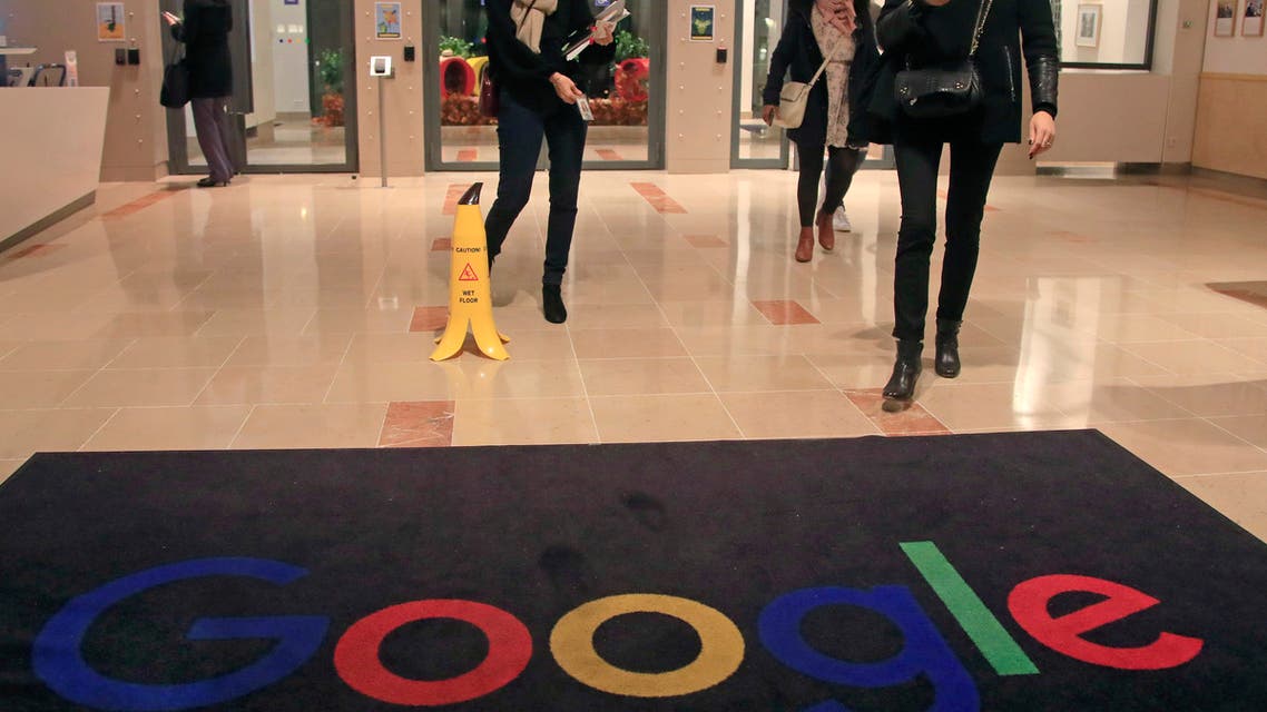 Google employees walks out of the entrance hall of Google France in Paris. (File Photo: AP)