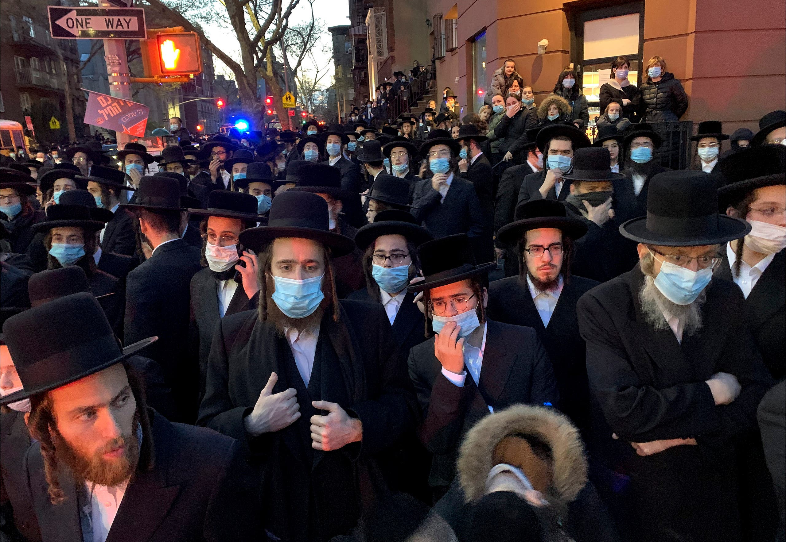 Hundreds of mourners gather in the Brooklyn borough of New York, Tuesday, April 28, 2020, to observe a funeral. (AP)