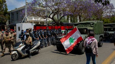 Lebanese soldiers from the military police unit stand guard during ongoing protests, outside the military court in Beirut on May 7, 2020. (AP)