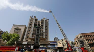 Indian firefighters use a hydraulic platform to sanitize an area during a nationwide lockdown to curb the spread of coronavirus, in Ahmedabad, on Saturday, May 9, 2020. (AP)
