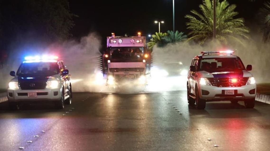 Abu Dhabi police patrol cars and a sterilization truck. (Instagram)
