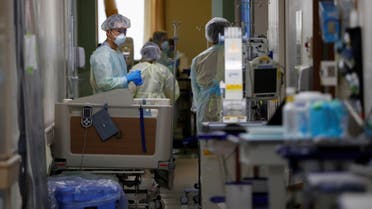 Medical workers wearing personal protective equipment work in the ICU for coronavirus patients at St. Marianna Medical University Hospital in Kawasaki, south of Tokyo, on May 4, 2020. (Reuters) 