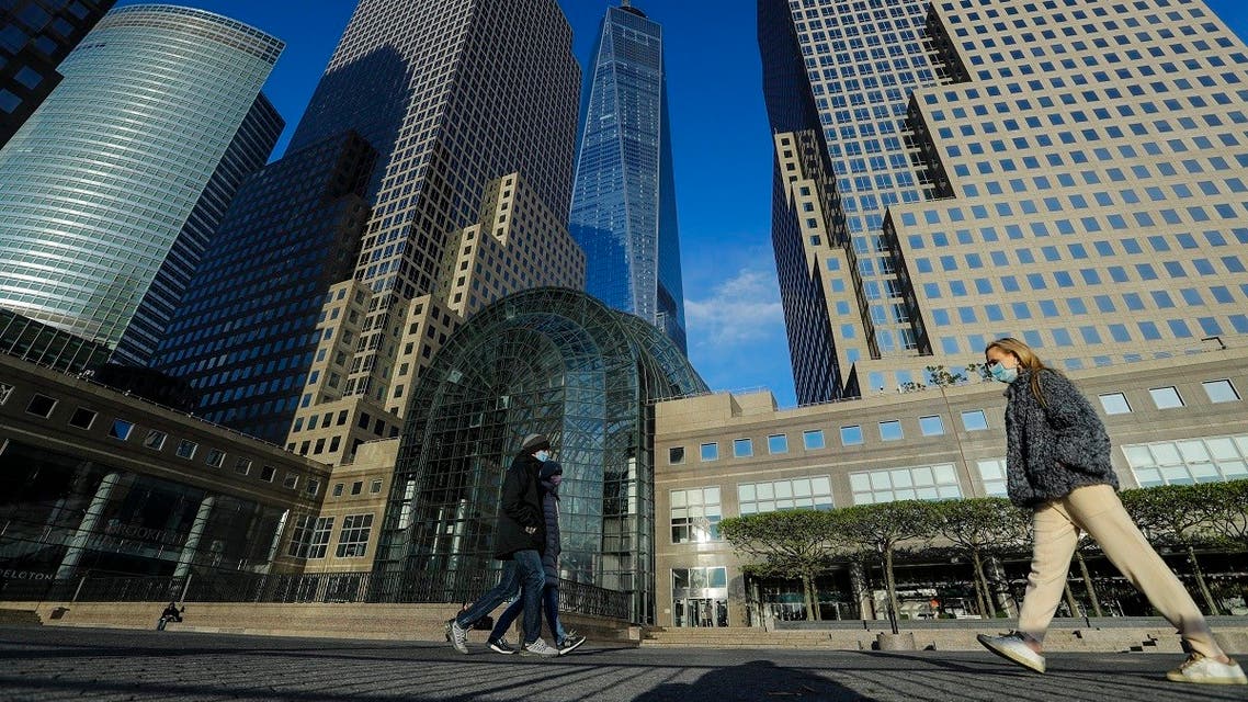 Pedestrians wear protective masks during the coronavirus pandemic as they walk past Brookfield Place Saturday, May 9, 2020, in New York. (AP)