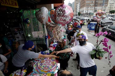 Balloons and flowers are sold on Mother’s Day at the Los Angeles Flower Market Sunday, May 10, 2020, in Los Angeles. (AP)