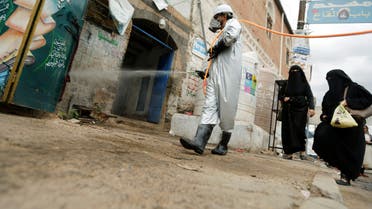 A health worker wearing a protective suit disinfects a market amid concerns of the spread of the coronavirus, in Sanaa, Yemen April 28, 2020. (Reuters)