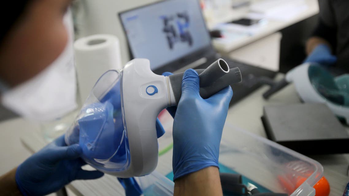 Volunteer dentists assemble snorkel masks and convert them into respirators, using 3D printing technology, to reinforce hospitals and help patients suffering from the coronavirus disease (COVID-19) in Algiers, Algeria April 15, 2020. Picture taken April 15, 2020. (Reuters)