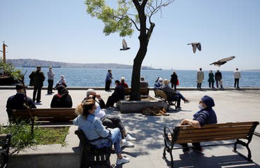 Senior Turkish citizens over 65 years old who are not allowed to go out of their houses since April 4 enjoy a sunny day in a park after being exempted from curfew for 4 hours amid the spread of the coronavirus disease (COVID-19), in Istanbul, Turkey, May 10, 2020. (Reuters)