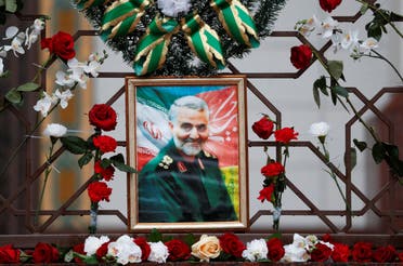 Flowers lie around a portrait of Iranian Major-General Qassem Soleimani, who was killed in an airstrike near Baghdad, at the Iranian embassy's fence in Minsk, Belarus January 10, 2020. (File photo: Reuters)