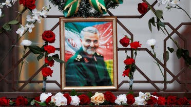 Flowers lie around a portrait of Iranian Major-General Qassem Soleimani, who was killed in an airstrike near Baghdad, at the Iranian embassy's fence in Minsk, Belarus January 10, 2020. (Reuters)
