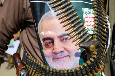 A supporter of the Houthis in Yemen has a poster attached to his waist of Iranian Major-General Qassem Soleimani, head of the Quds Force, who was killed in an air strike at Baghdad airport. The writing on the poster reads: God is the Greatest, Death to America, Death to Israel, Curse on the Jews, Victory to Islam. (Reuters)