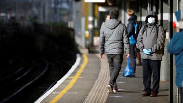 A commuter wears a mask at Canning Town station, following the outbreak of the coronavirus disease (COVID-19), London, Britain. (Reuters)