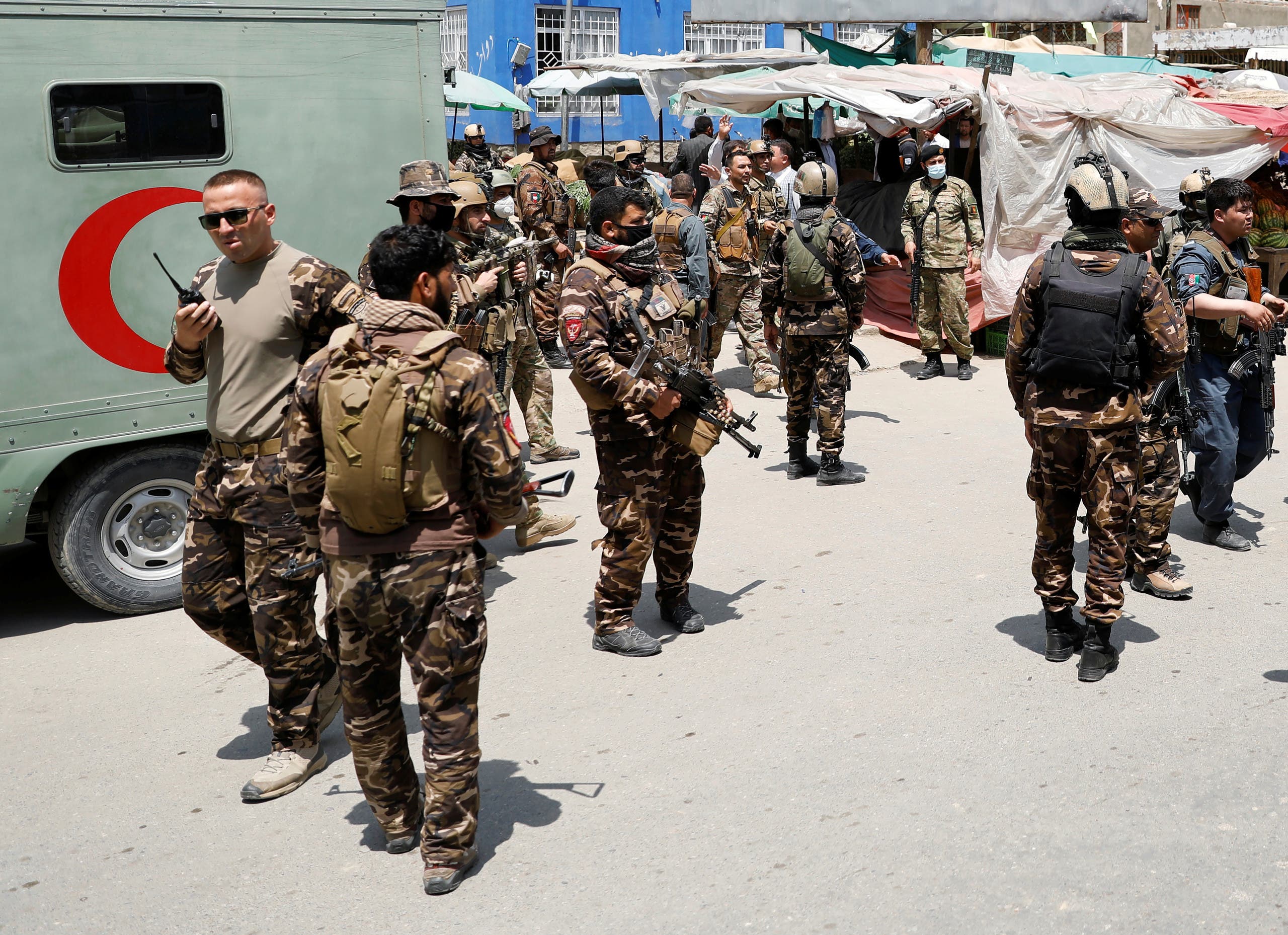 Afghan security forces stand guard outside a hospital which came under attack in Kabul, Afghanistan, on May 12, 2020.  (Reuters) 