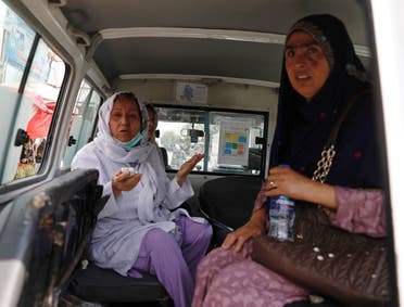 Afghan women sit in an ambulance after being rescued by security forces during an attack and gunfire at a hospital in Kabul, Afghanistan. (Reuters) 