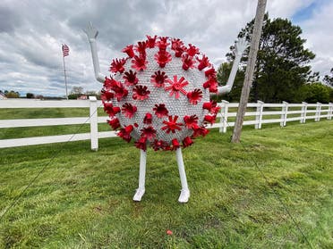 A sculpture in the likeness of a coronavirus particle is seen outside a property that borders a road leading to St. Michaels, Maryland, amid the coronavirus disease (COVID-19) outbreak in the US, April 27, 2020. (Reuters)