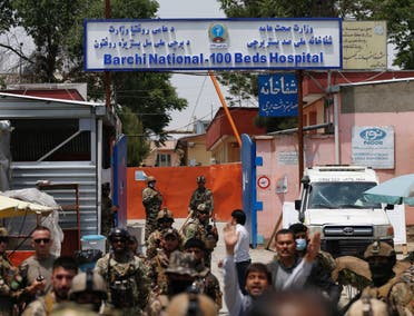 Afghan security forces stand guard outside Dasht-e-Barchi Hospital which came under attack in Kabul, on May 12, 2020.  (Reuters) 