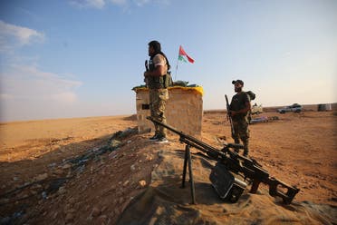 Iraqi Shia fighters of the PMU militias secure the border in al-Qaim in the Anbar province, opposite Albukamal in Syria's Deir Ezzor region. (File photo: AFP)