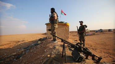 Iraqi Shia fighters of the PMU militias secure the border in al-Qaim in the Anbar province, opposite Albukamal in Syria's Deir Ezzor region. (File photo: AFP)