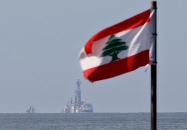 A Lebanese flag flutters in the wind as the drilling ship Tungsten Explorer is seen off the coast of Beirut. (File photo: AP)