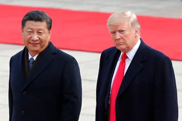 US President Donald Trump, right, walks with Chinese President Xi Jinping in Beijing on Nov. 9, 2017. (AP)