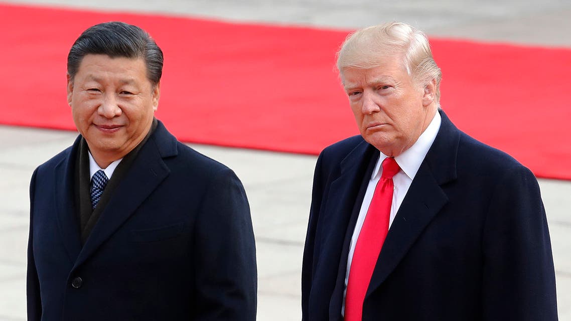 US President Donald Trump, right, walks with Chinese President Xi Jinping in Beijing on Nov. 9, 2017. (AP)
