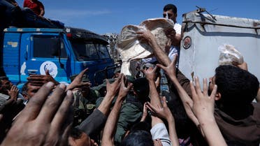 Syrian authorities distribute bread, vegetables and pasta to Douma residents, in the town of Douma, near Damascus, Syria. (File photo: AP)