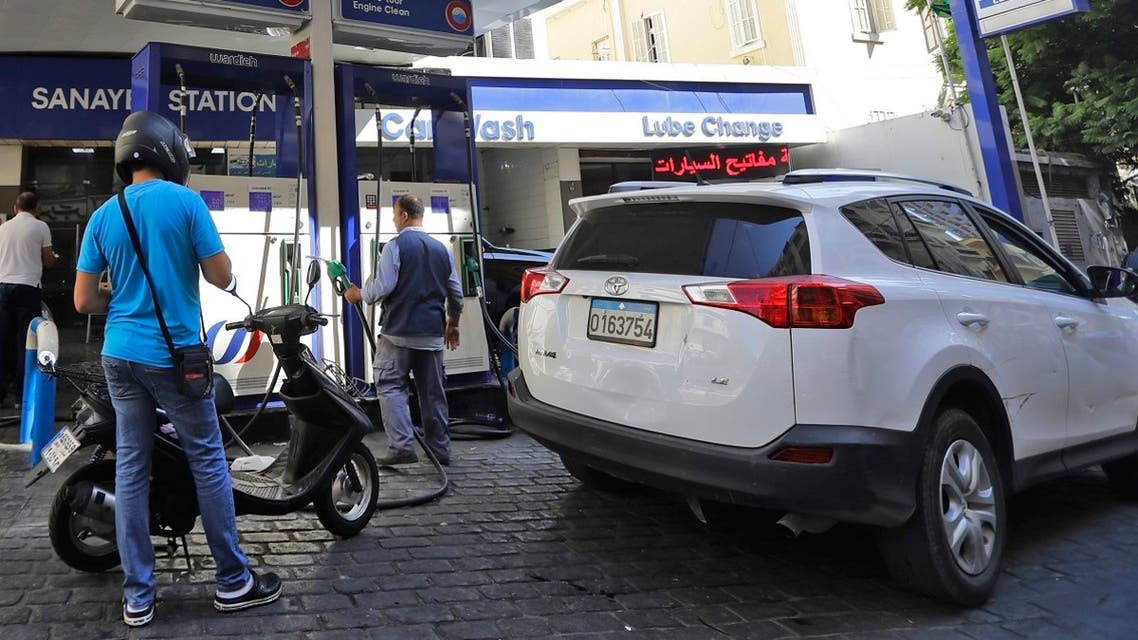 Drivers fill up at a petrol station in the Lebanese capital Beirut on September 27, 2019. (AFP)