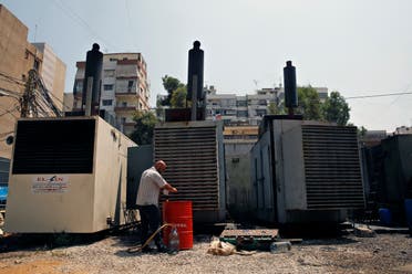 This Monday, July 16, 2018, photo shows Mamdouh al-Amari oiling privately-owned diesel generators that provide power to homes and businesses, in the southern suburbs of Beirut, Lebanon. (AP)