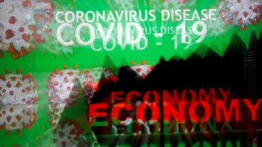A 3D-printed economy stock graph is seen in front of displayed coronavirus disease (COVID-19) words in this illustration taken March 24, 2020. (Reuters)