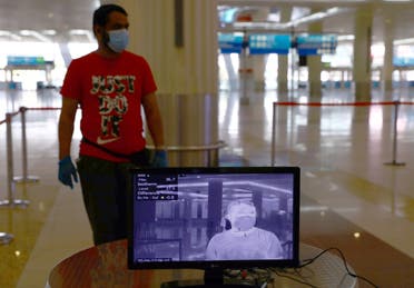 A man is seen through a thermal camera at Dubai International Airport amid the outbreak of the coronavirus in Dubai, UAE, April 27, 2020. (Reuters)