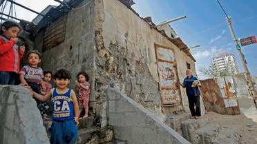 Palestinian children are pictured outside their shacks in Gaza City's Al-Shati refugee camp on May 15, 2020, as Palestinians marked the 72nd anniversary of ‘Nakba’ (Day of Catastrophe). (AFP)  
