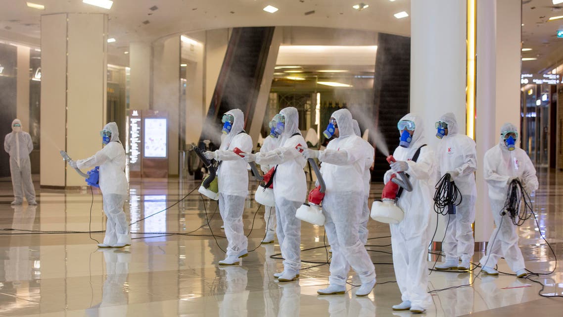 Cleaners in hazmat suits demonstrate disinfection at Siam Paragon, an upmarket shopping mall in Bangkok, Thailand, on Thursday, May 14, 2020. (AP)