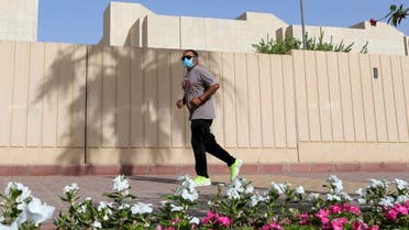 A man wears a protective face mask while jogging, following the outbreak of the coronavirus disease (COVID-19), in Riyadh, Saudi Arabia May 13, 2020. (Reuters)