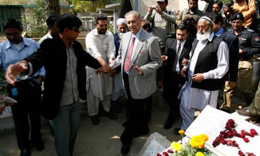  Pakistani nuclear scientist Abdul Qadeer Khan arrives to a graveyard after attending the funeral prayer for his brother, Abdul Qayyum Khan, in Karachi on February 13, 2010. (Reuters) 
