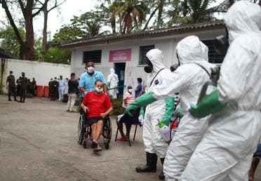 Brazilian army officers disinfect a shelter for elderly people, homeless and patients with mental disorders, amid concerns of the spread of the coronavirus, in Rio de Janeiro, Brazil, May 14, 2020. (Reuters)