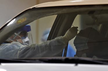 Health workers perform a nose swab test during a drive through coronavirus test campaign held in Diriyah hospital in the Saudi capital Riyadh. (File photo: AFP)