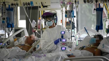 A healthcare worker attends to coronavirus patients at the Intensive Care Unit of the La Paz University Hospital in Madrid on April 23, 2020. (AFP)