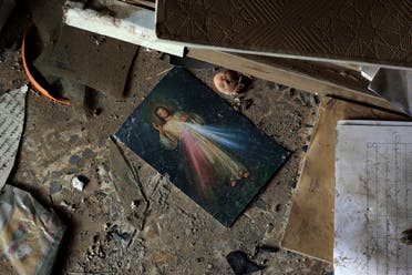 A picture of Jesus Christ lies on the ground inside a church damaged by ISIS militants during their occupation of the predominantly Christian town of Tilkaif, Iraq on Jan. 21, 2017. (AP)