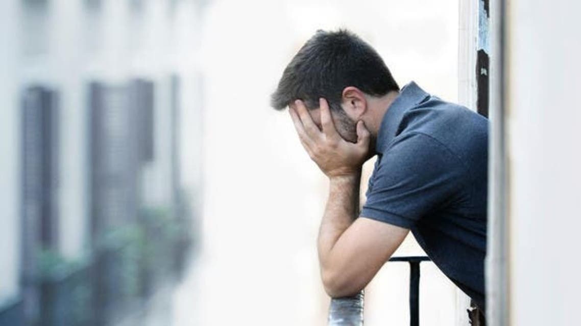 A man holding his head. (File photo: Shutterstock)