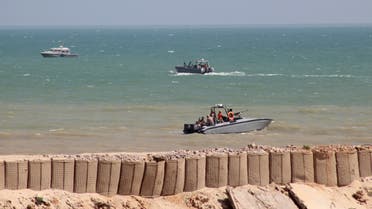 Yemeni pro-government forces are seen in military boats in Mukalla port, southwestern Yemen, on November 29, 2018. In azure waters off Yemen, newly minted coastguards stormed a fishing boat in a mock exercise as part of a war-scarred city's struggle to resurrect state institutions two years after Al-Qaeda's ouster. In a nation torn by conflict, the former jihadist bastion of Mukalla stands out as an oasis of stability, offering what many call a blueprint for post-war Yemen.