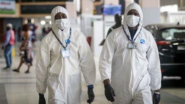 Nigerian aviation workers wear protective clothing as US citizens queue to check in and be repatriated at the Murtala Mohammed International Airport in Lagos, Nigeria Tuesday, April 7, 2020. (File photo: AP)