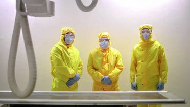 A picture taken by a doctor at the Sheikh Zayed hospital in the Egyptian capital Cairo on April 25, 2020, shows radiology technicians, wearing protective gear, posing for a picture in a lab in the isolated ward for the coronavirus (COVID-19) patients. The virus has so far infected over 8,000 people and claimed 514 lives in Egypt, according to official figures.