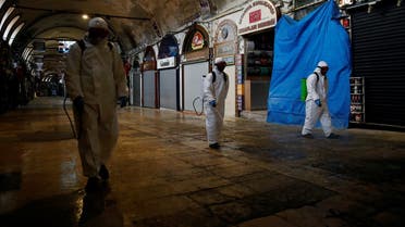 Workers spray disinfectant at Grand Bazaar which will re-open completely on June 1, amid the spread of the coronavirus disease in Istanbul, Turkey, May 8, 2020. (Reuters)