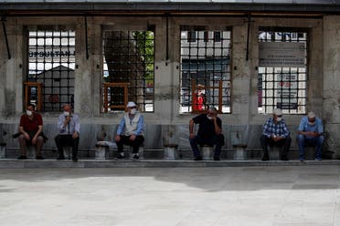 Turkish citizen rest at the courtyard of Eyup Sultan Mosque after seniors over 65 years old had been exempted from curfew for 6 hours amid the spread of the coronavirus disease in Istanbul, Turkey, May 17, 2020. (Reuters)